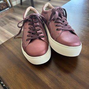 Shiny rose colored sneakers. Never worn, no tags.